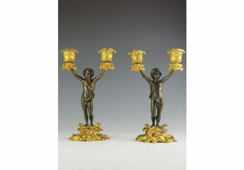 Pair Of 19th Century Bronze And Ormolu Twin Light Cherub Candelabra