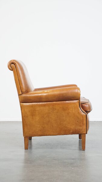 Comfortable, Neat Sheepskin Armchair, Neatly Finished With Black Piping And In Good Condition photo for sale