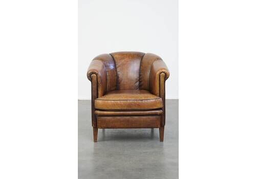 Comfortable Vintage Sheepskin Club Chair With A Special, Characteristic Appearance And Finished With Black Piping.