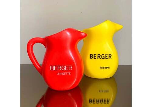 A Pair Of Vintage French Berger Anisette & Sirops Red & Yellow Plastic Jugs