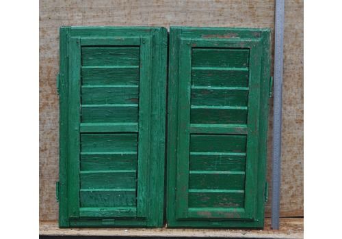 A Pair Of Green And White Window Shutters