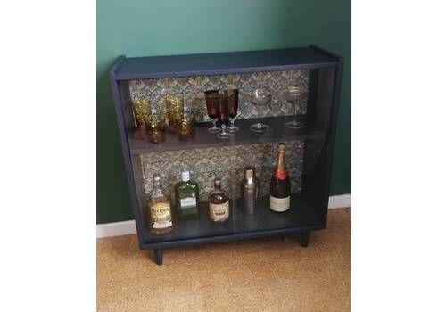 Mid Century Cocktail Cabinet Bookcase With Sliding Glass Doors And William Morris Print Interior Painted In Farrow And Ball Blue